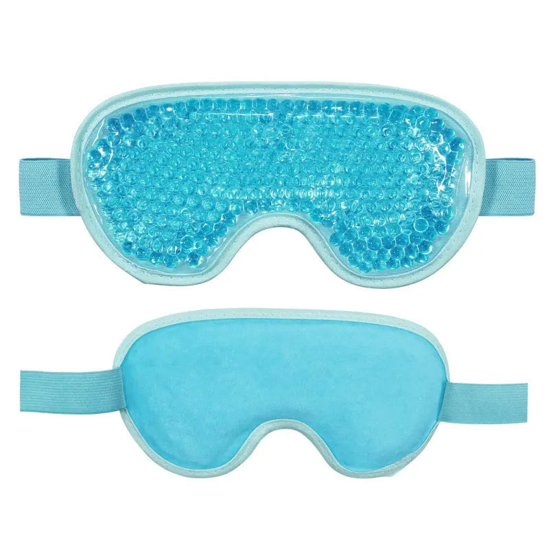 White rechargeable portable eye compress device with USB cable and eye mask.
