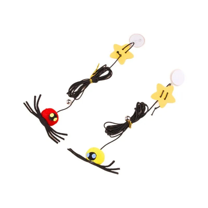 Red and yellow hanging door cat toy with elastic rope, feather, bell, and spider attachments