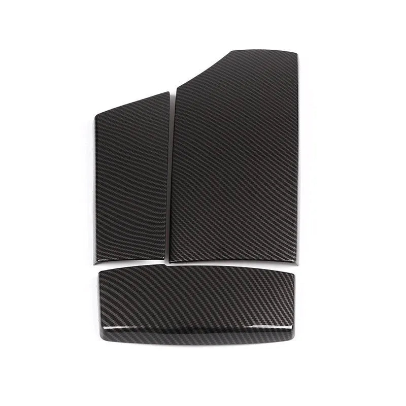 Three black ABS armrest box protective covers with a shiny carbon fibre weave pattern.