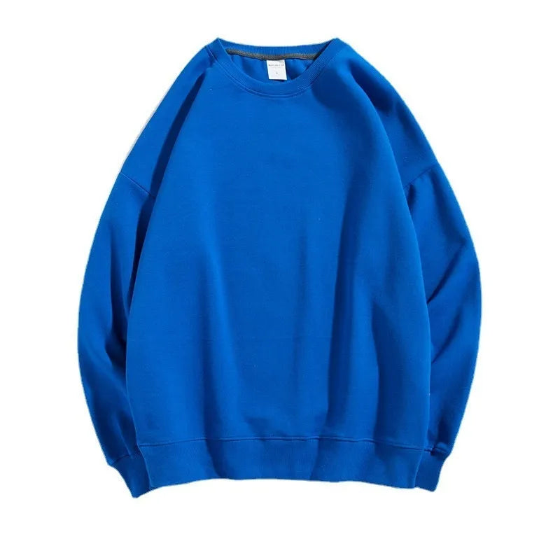 A loose-fitting, light blue off shoulder sweater with long sleeves and a round neck, made from cotton.