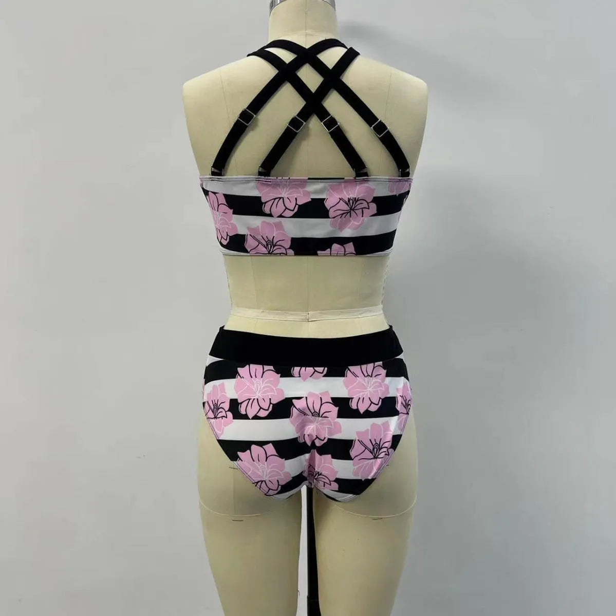 Black women's high-waisted bikini with a slimming belly-covered brief and split top.