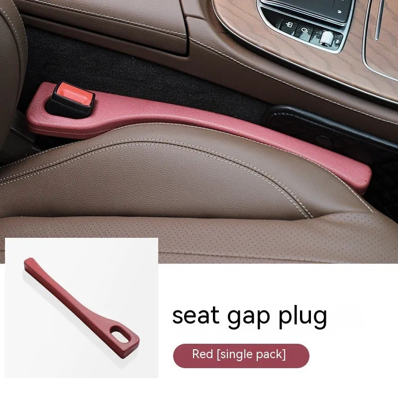 Polyurethane car seat gap filler strip in black, shown next to a vehicle centre console.