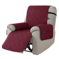Quilted burgundy sofa cover stretched over a single seat cushion, showing three-line stitching pattern.