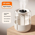 Beige round USB humidifier with dual spray nozzles, humidity display, and night light on wooden surface