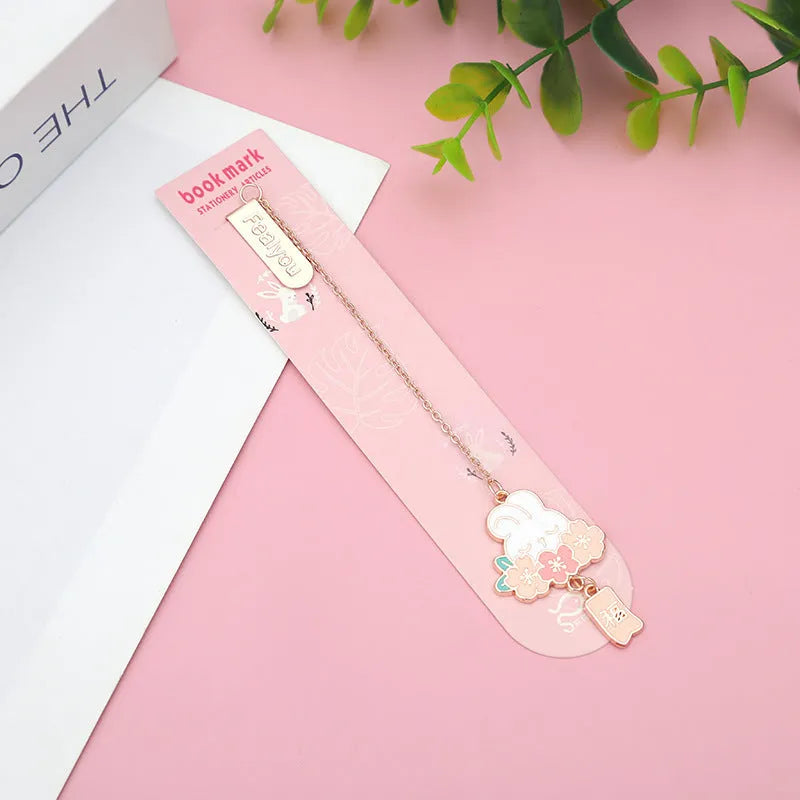 Metal book holder with cherry cat pendant decoration for journals and books