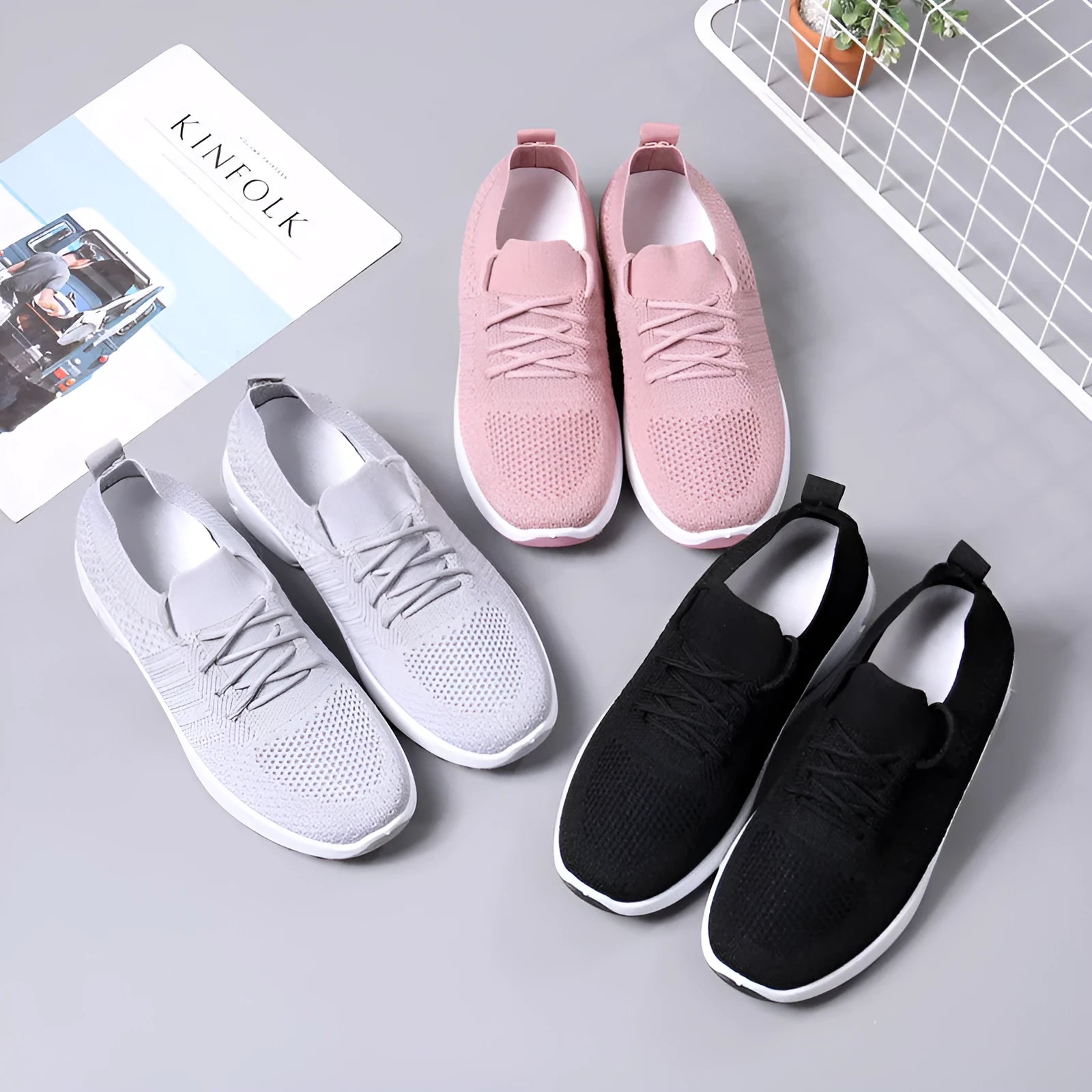 Women's black mesh casual sneaker with a round toe and white non-slip PVC sole on a light background.