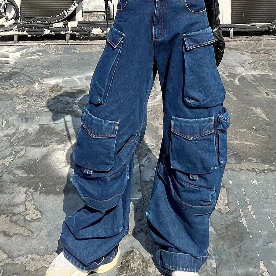 Dark blue distressed wide-leg high-waist jeans with multiple pockets on a mannequin.