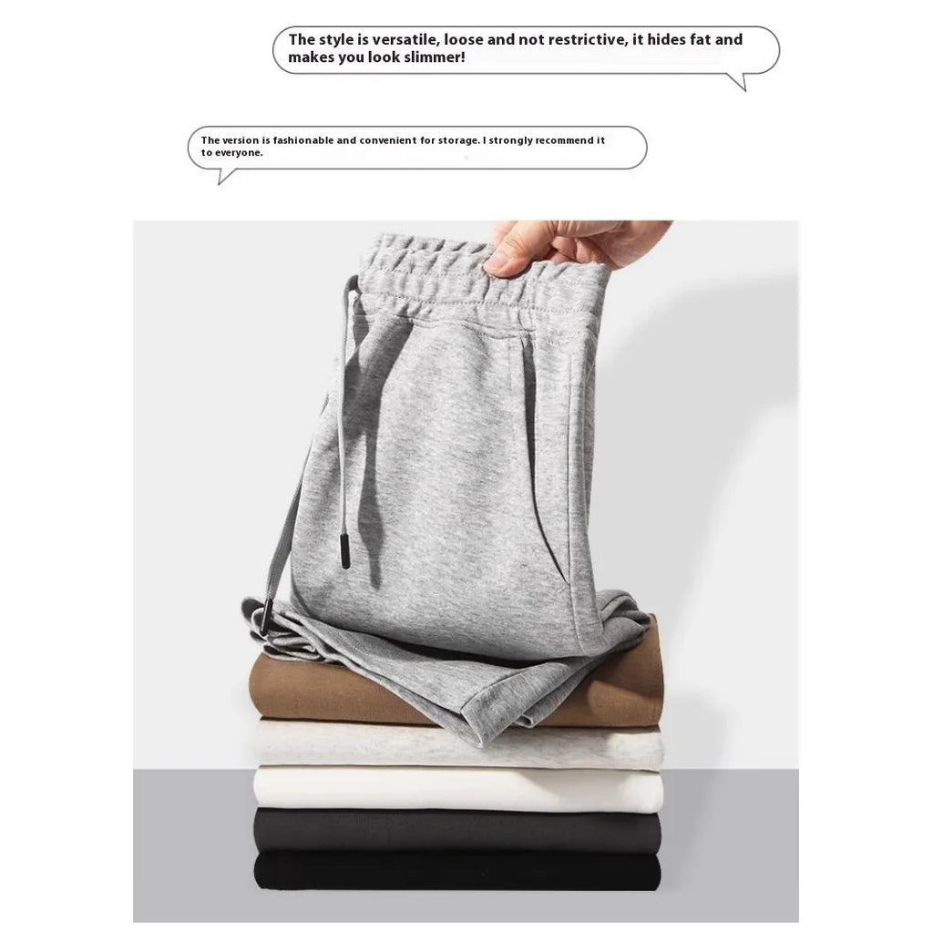 Men's straight leg cotton sports shorts in a light grey colour, showing a relaxed fit suitable for summer.