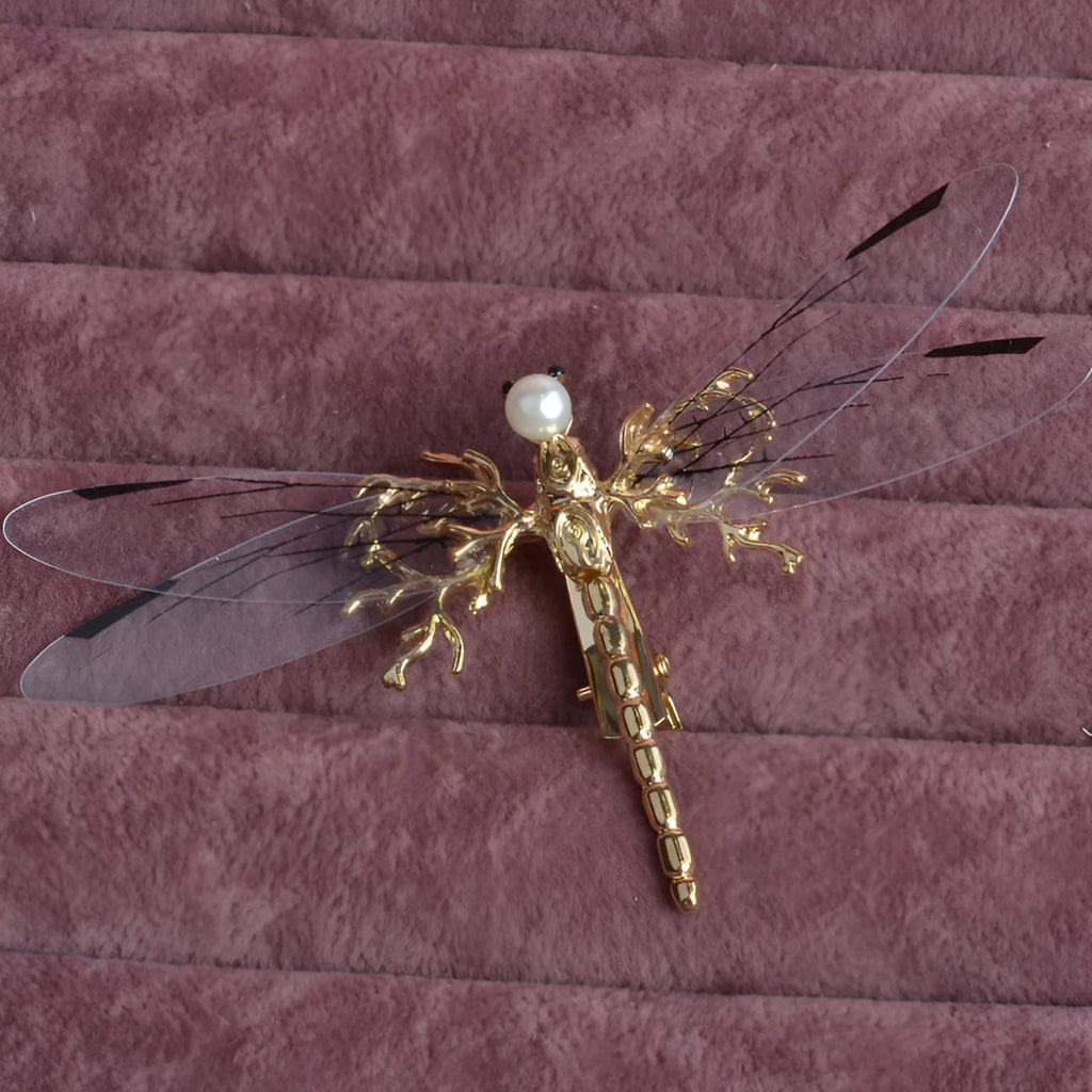 Golden electroplated alloy dragonfly side clip headdress for women.