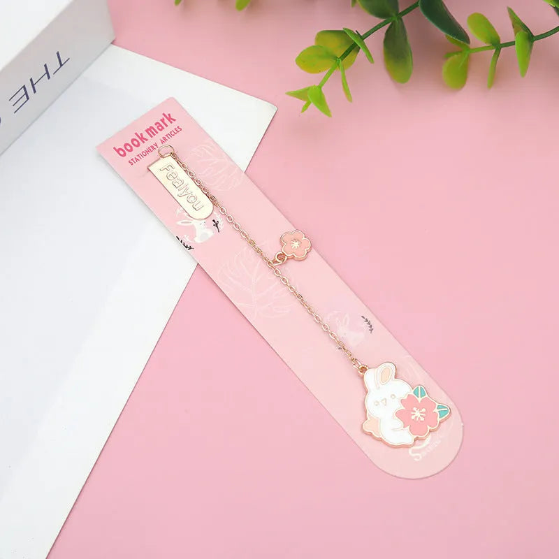 Metal book holder with cherry cat pendant decoration for journals and books