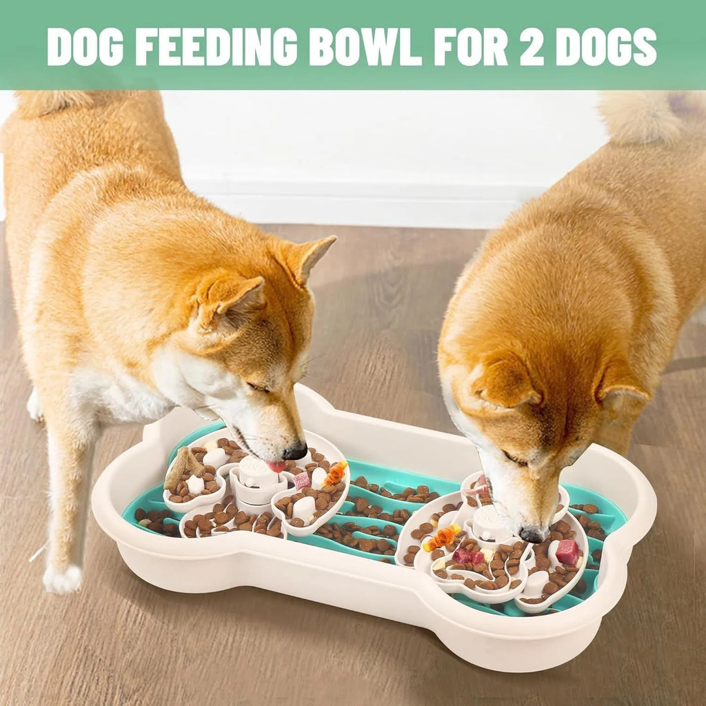 Large green slow feeder dog bowl with wave-pattern trays and suction cups on a wooden floor.