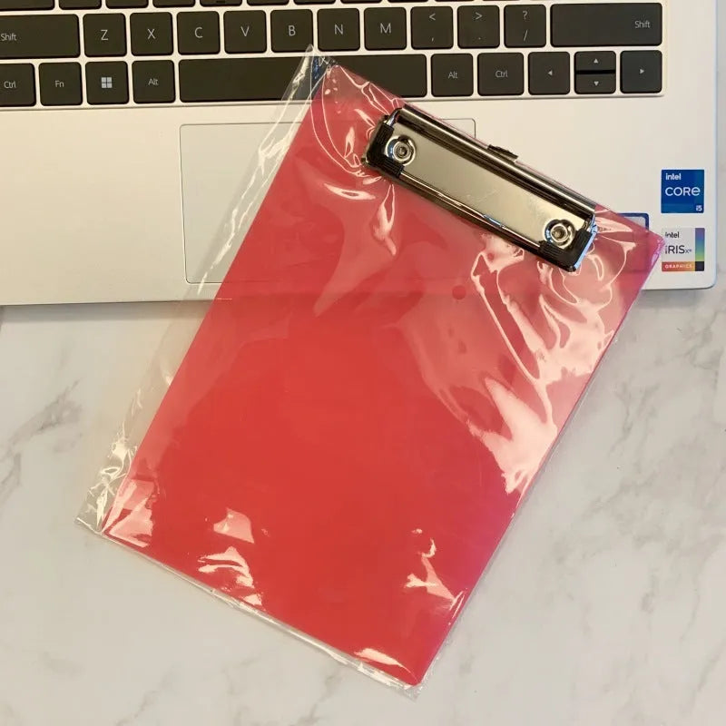 Transparent A4 plate writing board pad with a silver metal flat clip, shown in a blue colour option.