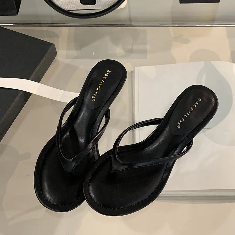 Women's round toe stiletto flip-flop sandals in black and camel colours showing open-toed design