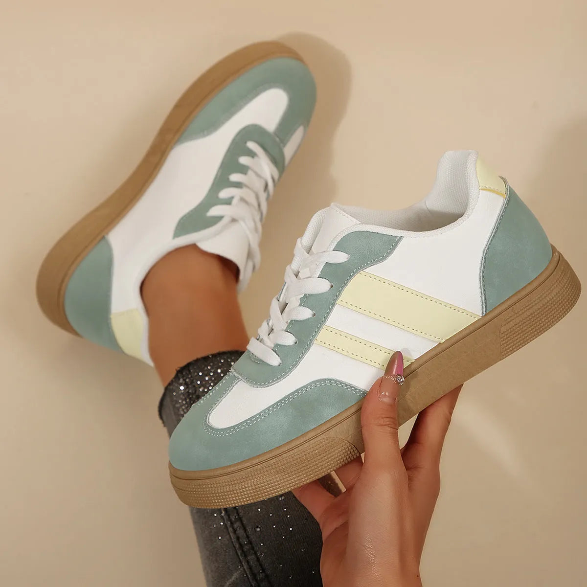 Green women's retro sports shoes with cross strap detail and round toe