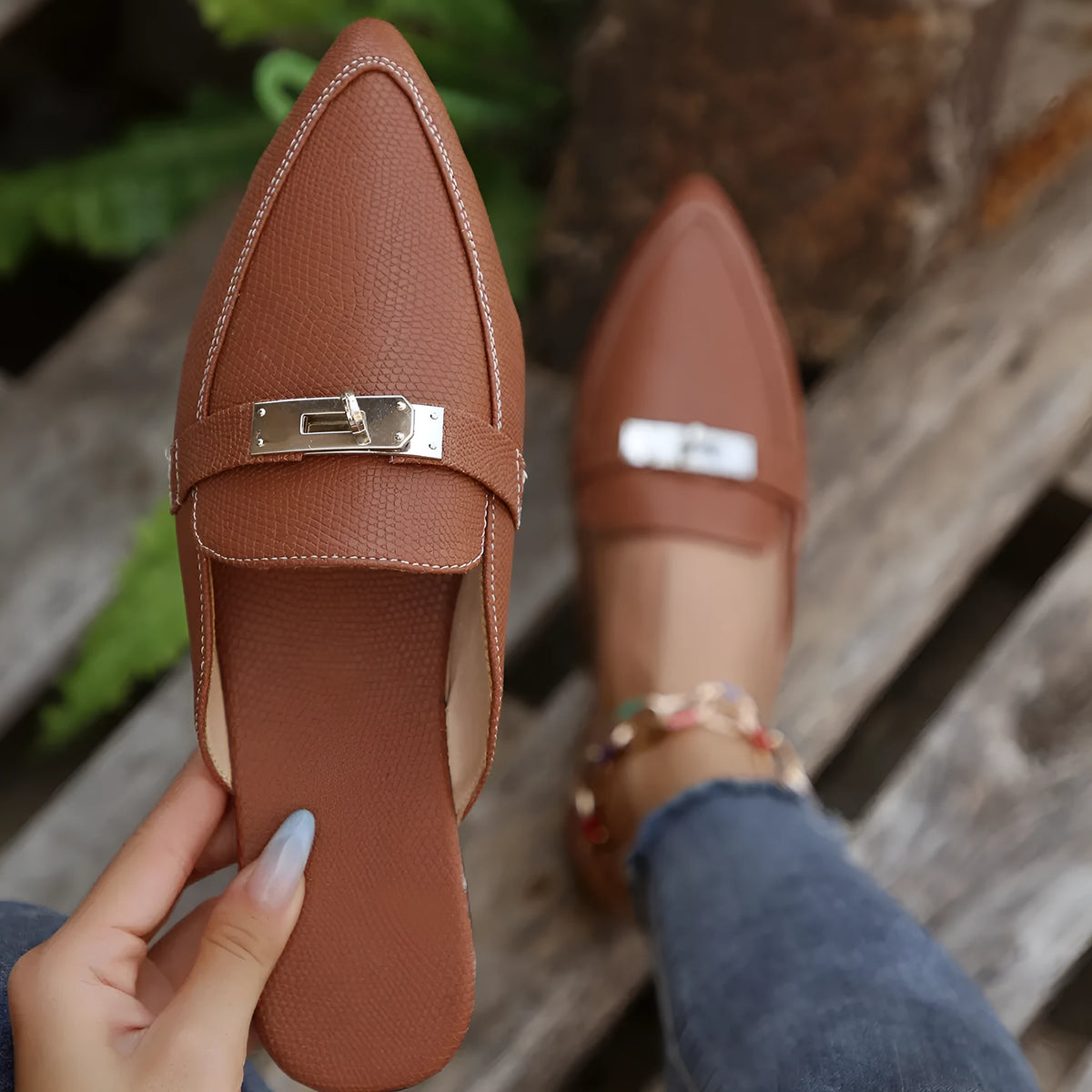 Light brown women's pointed toe low heel semi-slippers with a PU upper and rubber sole.