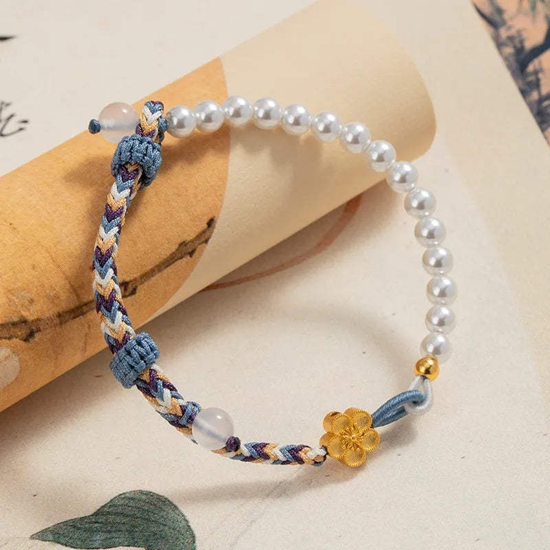Peach coloured carrying strap bracelet with Chinese flower weaving pattern featuring sterling silver chalcedony and pearl decorative elements