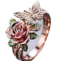 Colourful oil treatment fairy style ring with adjustable alloy construction showing flower, insect and leaf modelling