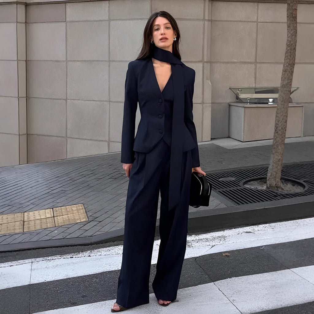 Women's navy blue halter suit set with polyester top and full-length trousers in sizes S M L