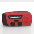 Red rechargeable emergency hand torch with AM/FM radio and wrist strap for disaster preparedness