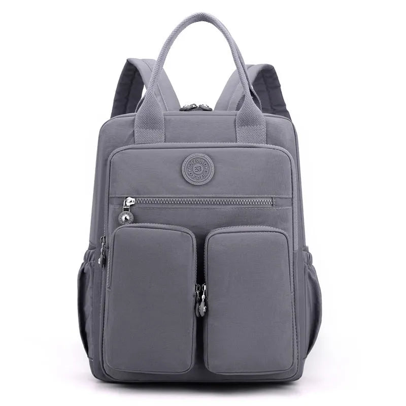 Women's waterproof nylon travel backpack showing internal organisation compartments and colour options