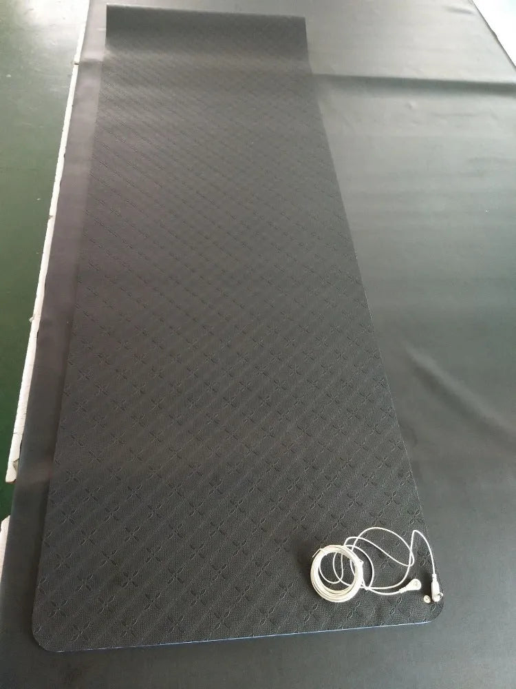 Blue conductive yoga mat with plants pattern, showing grounding wire and 182cm x 61cm x 5mm dimensions.