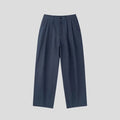 Men's apricot-coloured wide-leg cotton linen trousers with an elastic waistband on a hanger.