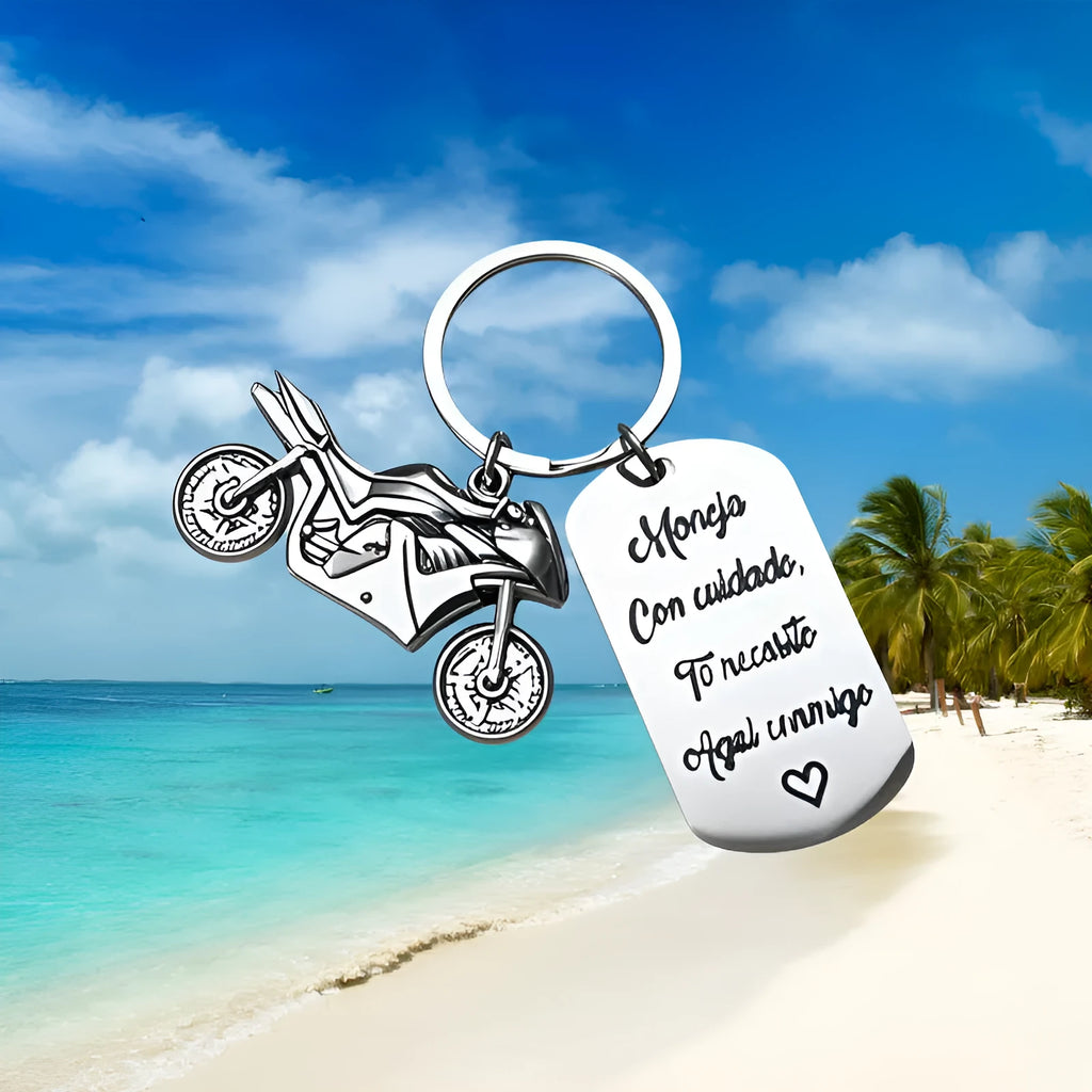 Stainless steel motorcycle key chain with charm and grey flannel storage bag.
