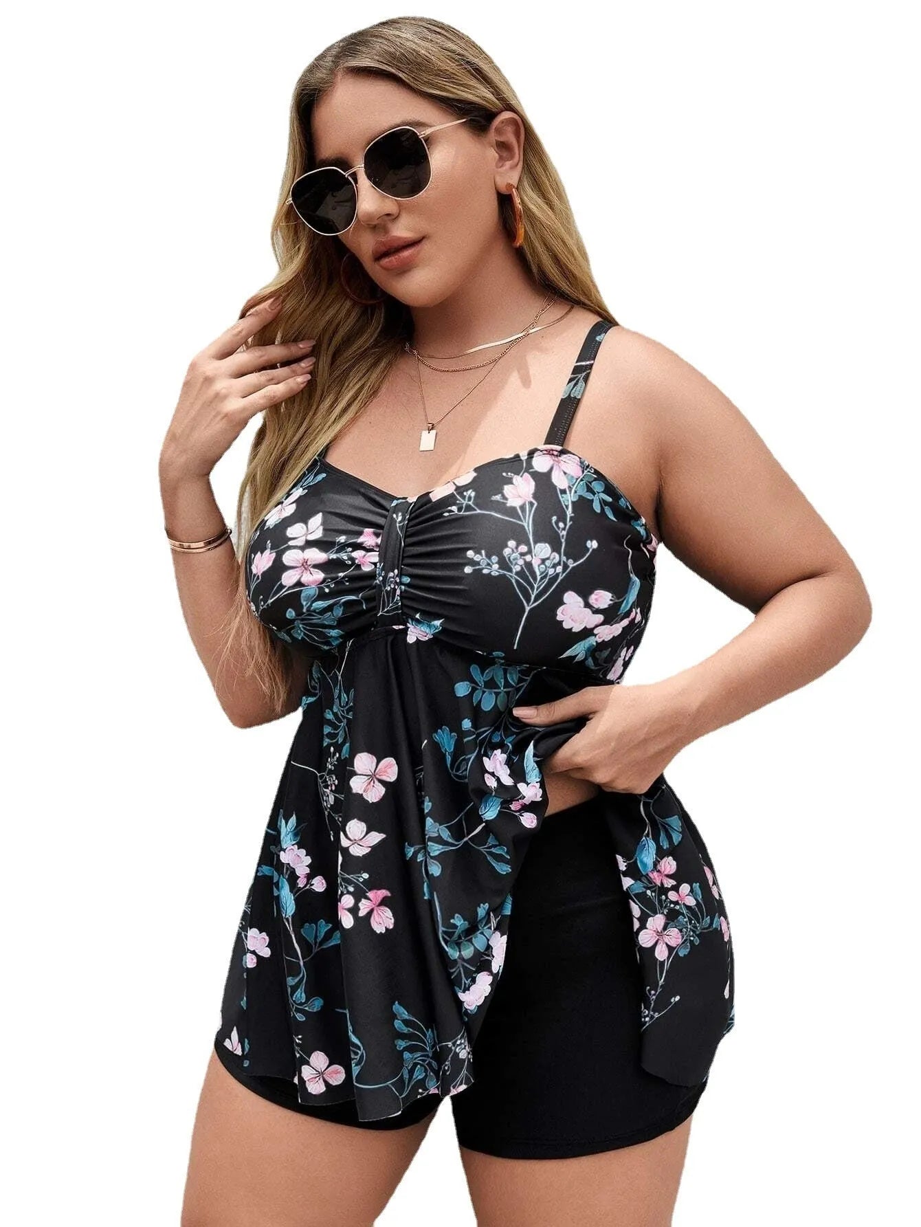 Women's floral print one-piece swimsuit with split colour design on a mannequin.