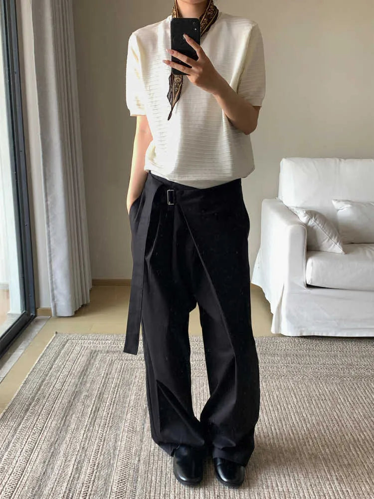 Black straight-leg trousers with a single front pleat and adjustable waistband on a hanger.