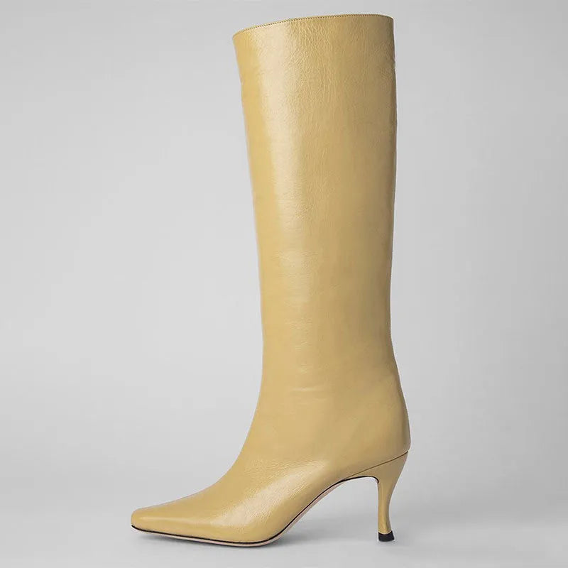 Women's black square toe ankle cowboy boot with microfiber upper on a white background.