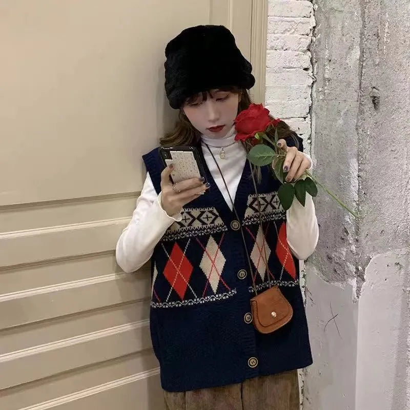 Loose sleeveless cardigan top in diamond plaid acrylic knit showing khaki navy blue and red colour options