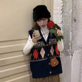 Loose sleeveless cardigan top in diamond plaid acrylic knit showing khaki navy blue and red colour options