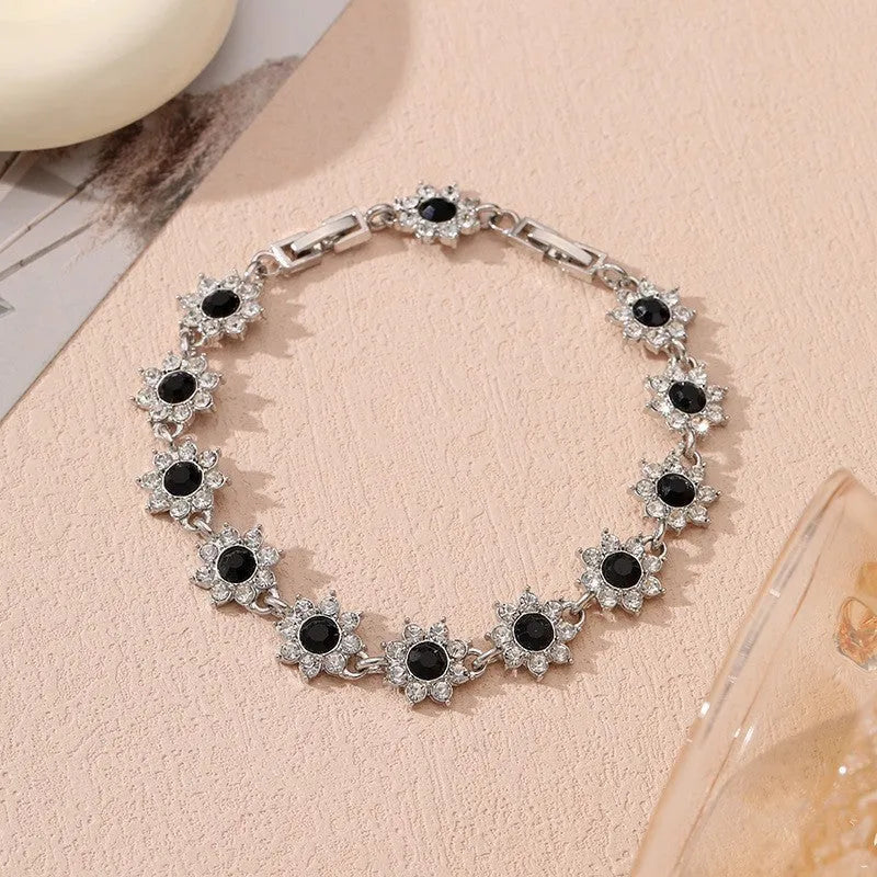 Flower charm bracelet in zinc alloy with electroplated finish and colourful crystal accents