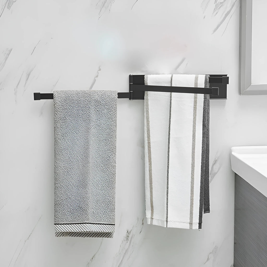 Black folding towel bar mounted on a bathroom wall with no visible screws or drill holes.