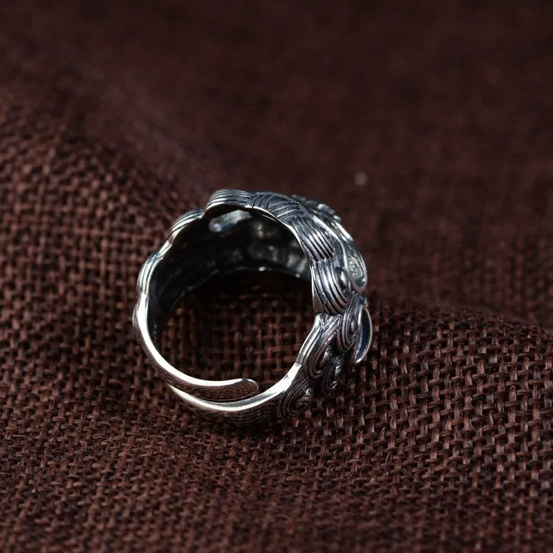 Sterling silver open ring showing animal or zodiac pattern detail with adjustable design
