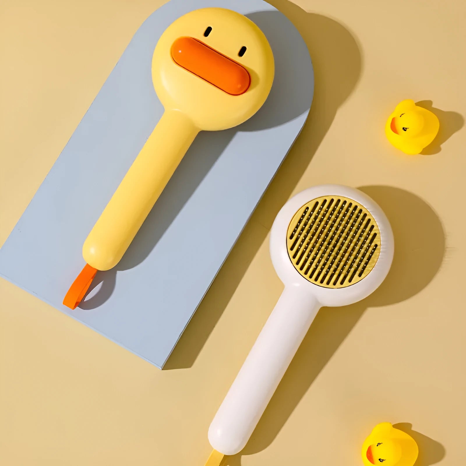 Small yellow duck decorative handle cat grooming comb with open section needle teeth for pet hair removal