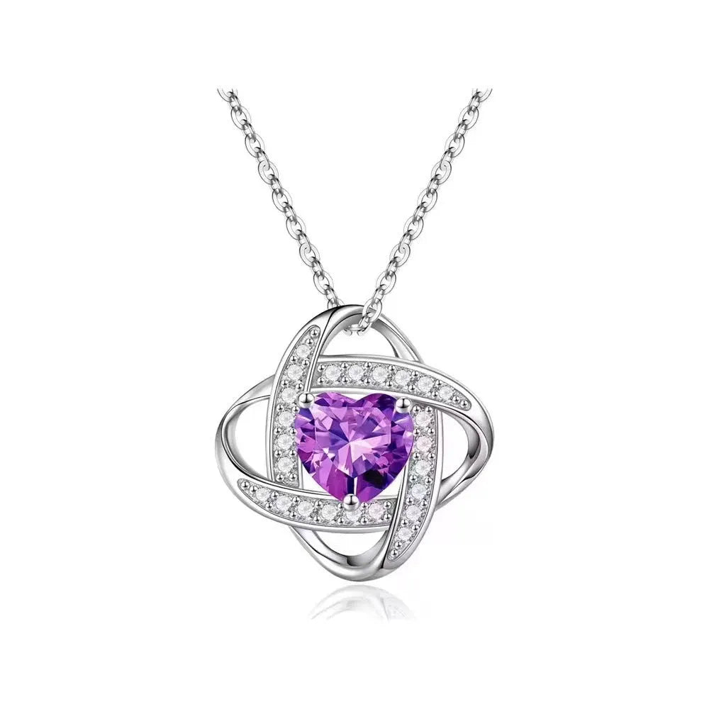 Copper heart necklace with electroplated platinum finish in five colour variations on model