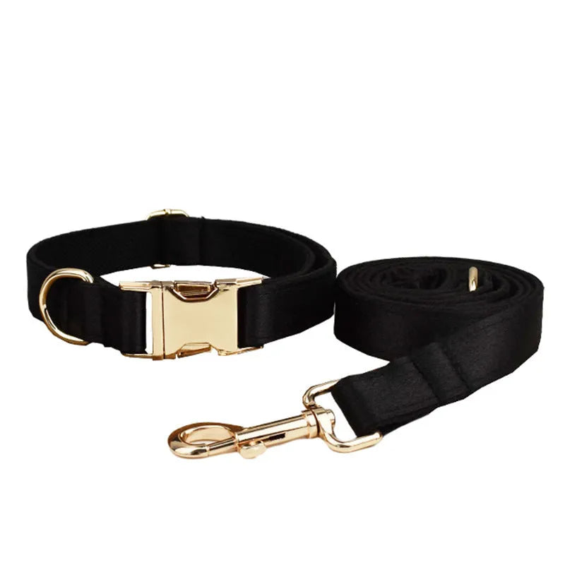 A cloth dog collar, matching leash, decorative bow, and dog vest set laid out flat, showing the coordinated design.