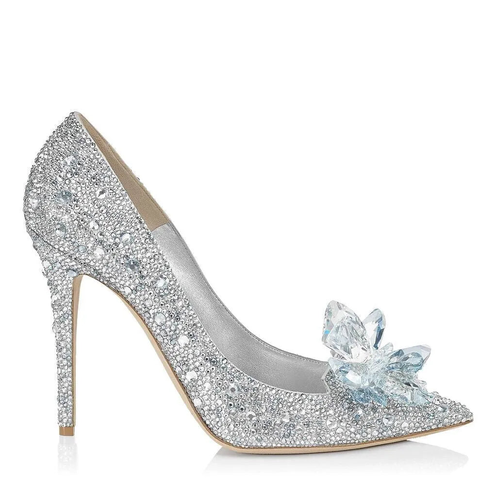 Women's gold high heel shoes with rhinestone detailing and pointed toe design