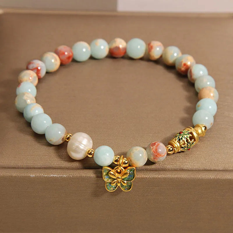 Blue women's bracelet with butterfly pendant, freshwater pearl, and Shoushan Stone elements