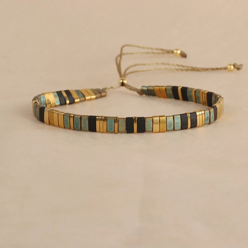 Geometric glass beaded bracelet in retro green colour with round elements