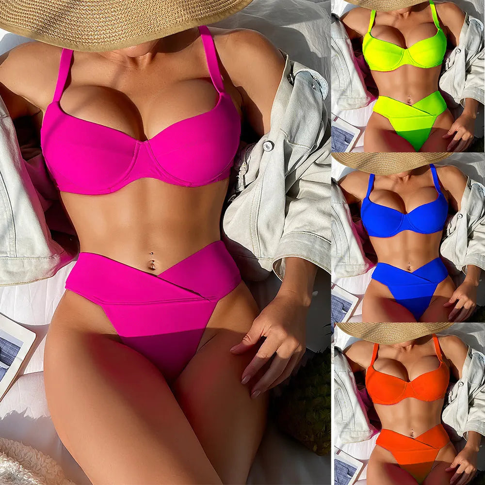 Solid colour briefs style bikini swimsuit in fluorescent pink on a mannequin.