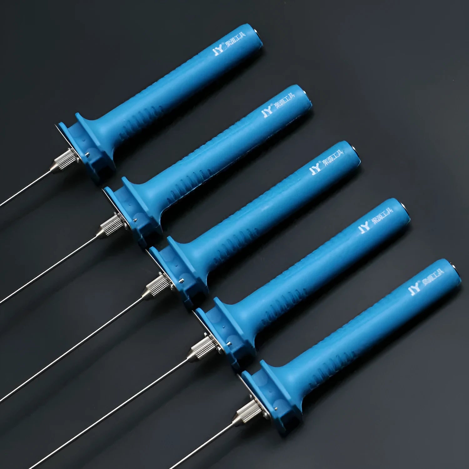 Blue handled electric heating foam cutter pen with a selection of different length metal blades.