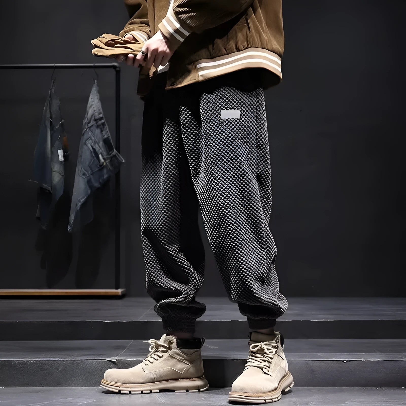 Men's grey ankle-tied straight-leg sweatpants laid flat, showing non-ironing polyester blend fabric.
