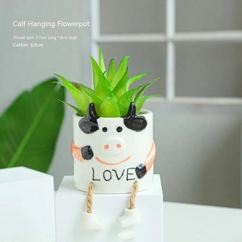 Ceramic hanging foot flowerpot for succulent plants in cartoon style with twelve colour variations on desktop
