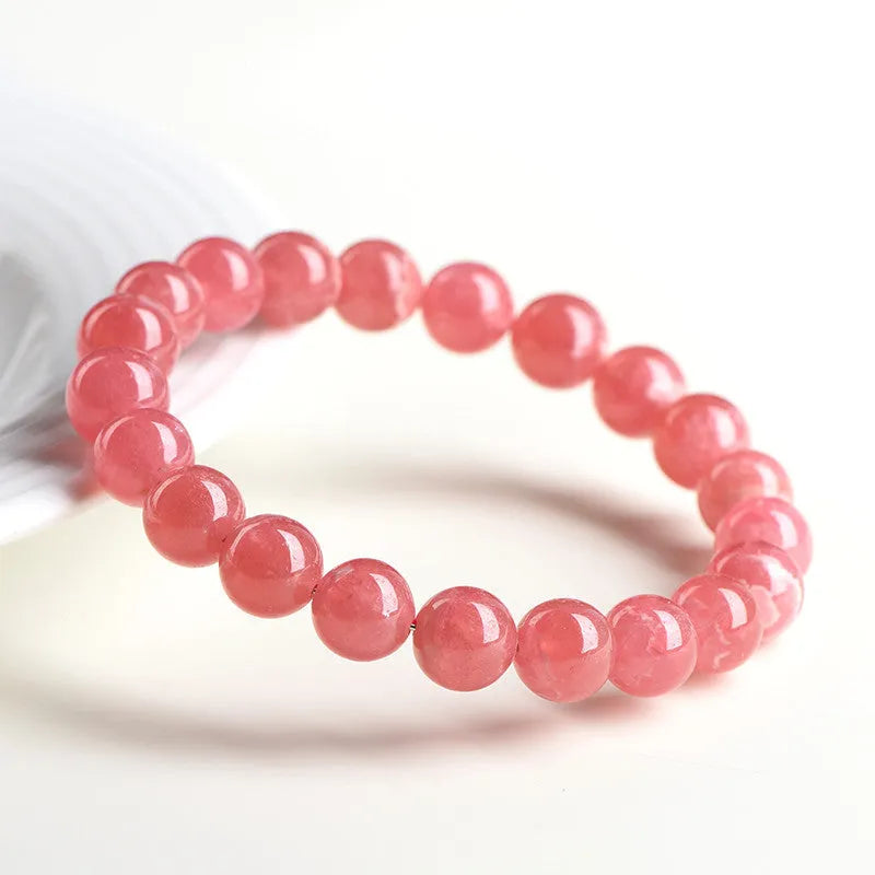 Women's crystal bracelet with geometric red stone beads and longevity lock charm