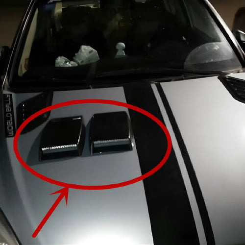 Black, white, and silver ABS plastic decorative simulation air vent for car interior styling.