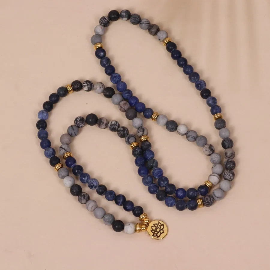 Blue patterned network stone beads on a multi-layer bracelet with an alloy clasp.