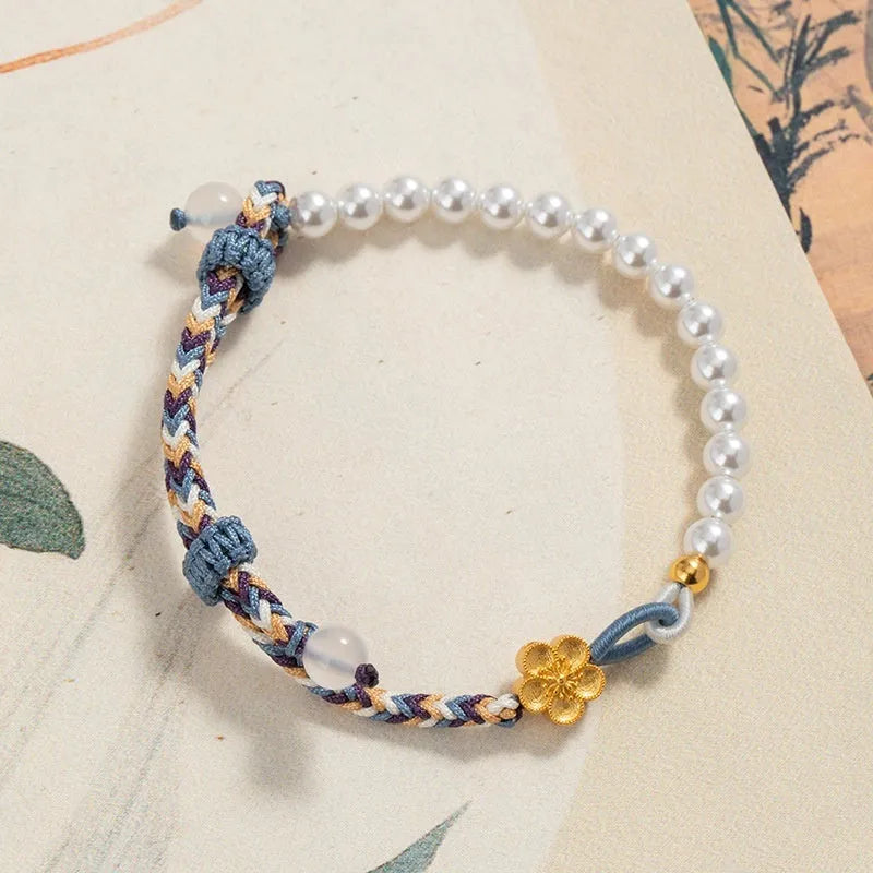 Peach coloured carrying strap bracelet with Chinese flower weaving pattern featuring sterling silver chalcedony and pearl decorative elements