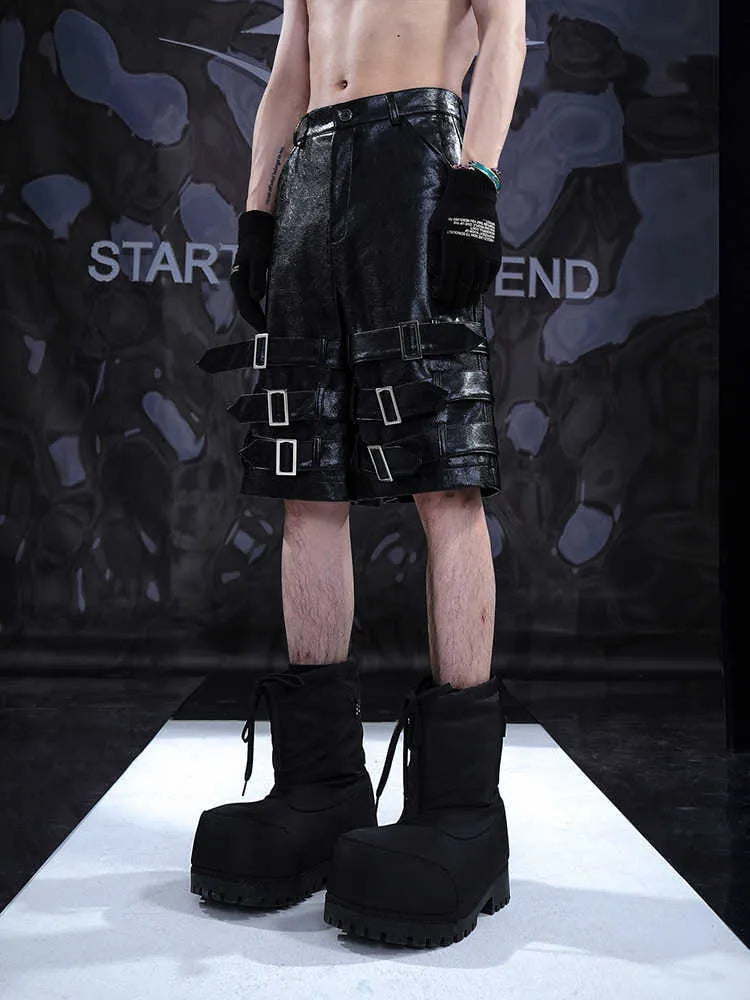 Men's black PU leather cropped pants showing mid to low waist design and flexible polycarbaminate construction